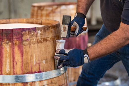 Slow Motion Of Yellow Spray Bottle Drops On Black Backgroundの写真素材