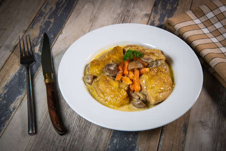 Recipe for chicken fricassee in white wine, with a carrot and mushroom planterの写真素材
