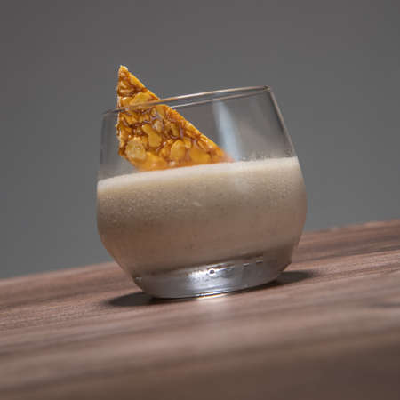 Bavarian recipe with pear and vanilla served with almond nougatineの写真素材