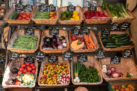 Vendor counter with colorful fruits and vegetablesの写真素材