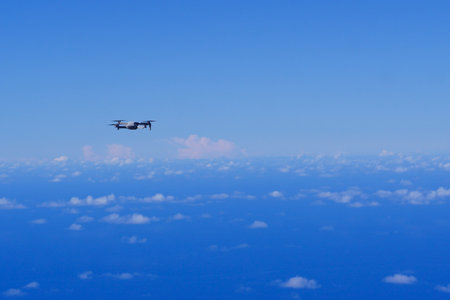Drone protection flying during the day in blue sky