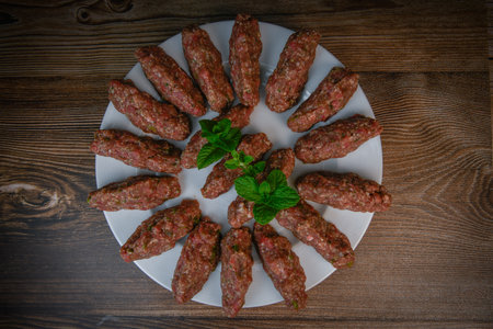 RECIPE FOR LEBANESE KEBBE NAYYHE, RAW MINCED BEEF, MARJORAM, MINT, ONIONS, CRUSHED WHEAT, SEVEN...
