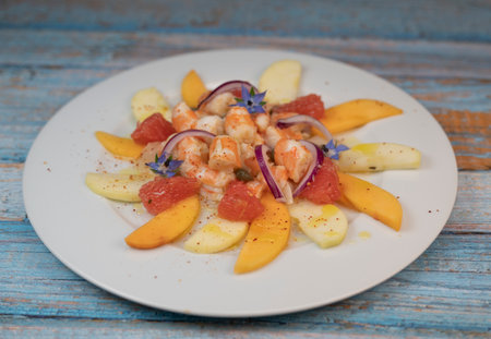 RECIPE CEVICHE OF SHRIMPS AND SCALLOPS WITH CITRUS FRUIT, LEMON, LIME, SQUEEZED ORANGE, GRAPEFRUIT AND FRUITの写真素材