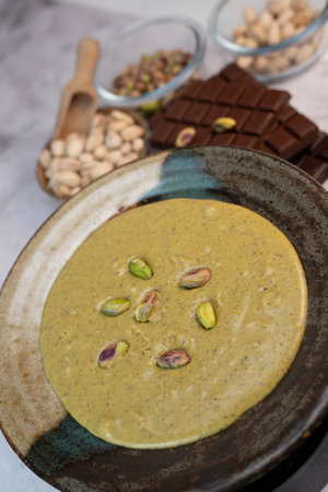 Creamy pistachio spread perfect for chocolate desserts in Dubai
