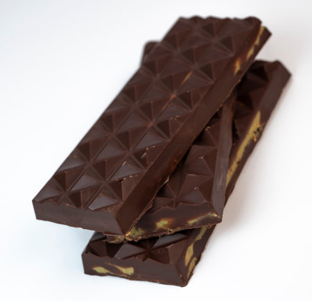 Delicious layers with rich chocolate displayed on a clean, white background during a food styling shootの写真素材