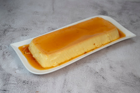 Cream caramel pudding with caramel sauce on a plate, Flanの写真素材