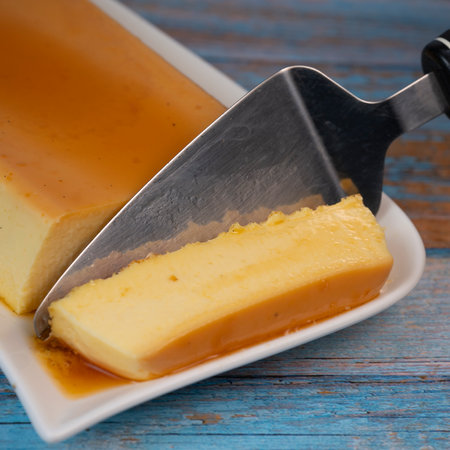 Cream caramel pudding with caramel sauce on a plateの写真素材