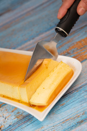 Cream caramel pudding with caramel sauce on a plateの写真素材
