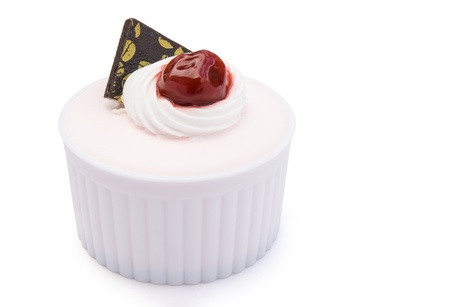 pink cake with cherry on top の写真素材