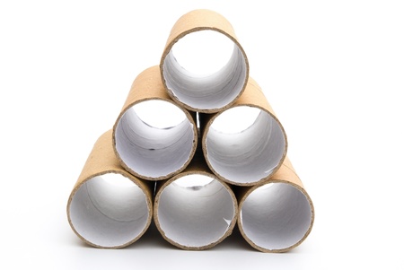 empty toilet rolls stack up on whiteの写真素材