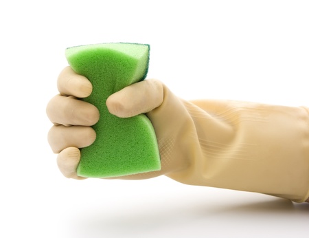 grabing a double side green cleaning spongeの写真素材