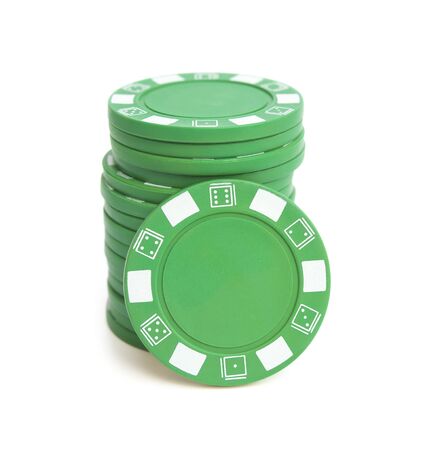 stack of green poker chips on white backgroundの写真素材