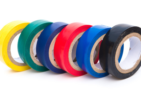 different color electrical tapes on white background