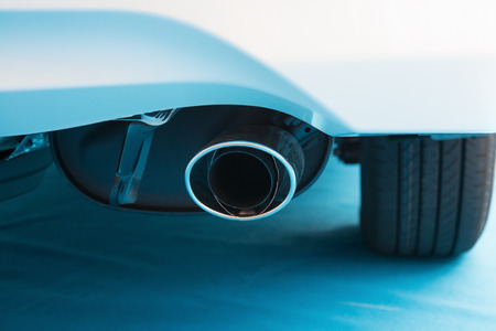 exhaust pipe of a white car on blue carpetの写真素材