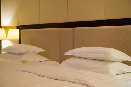 side view of two beds in a hotel room
