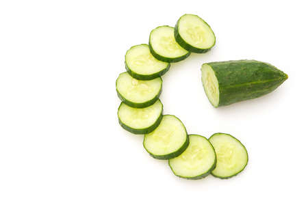 fresh cucumber slices on white backgroundの写真素材