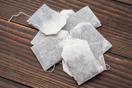 teabags on wooden backgroundの写真素材