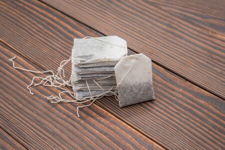 teabags on a wooden backgroundの写真素材