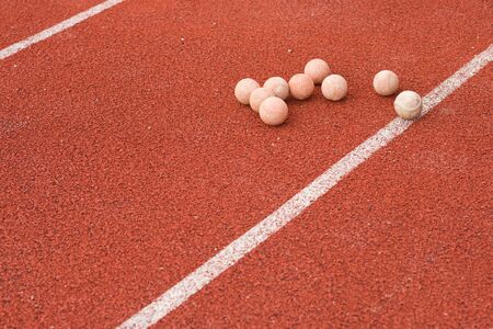 baseballs on rubber runway