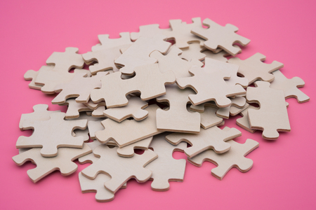 jigsaw puzzle on a pink backgroundの写真素材