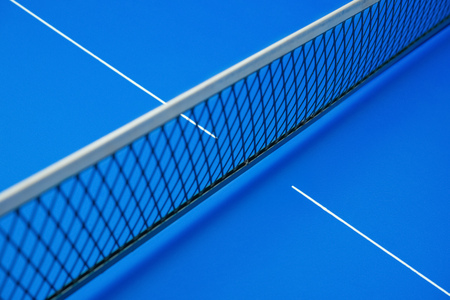 net on a blue pingpong tableの写真素材