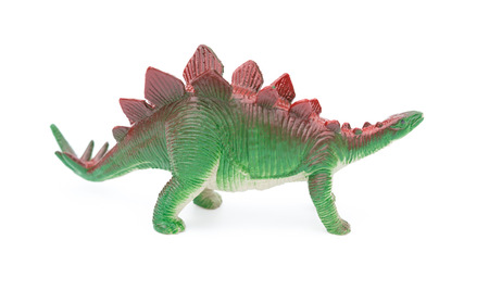 side view green stegosaurus toy on a white backgroundの写真素材
