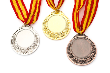 set of gold, silver and bronze award medals on white backgroundの写真素材
