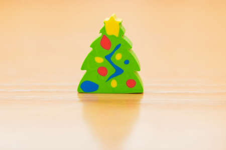 green christmas tree model on a wood tableの写真素材