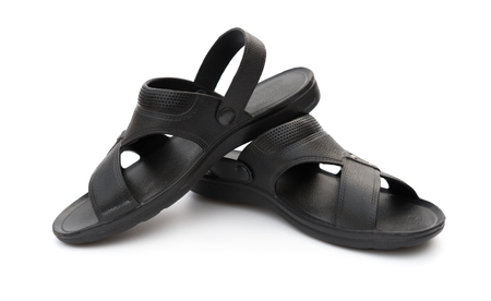 pair of black leisure sandal on white backgroundの写真素材