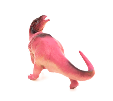 lilac plastic dinosaur toy on a white backgroundの写真素材
