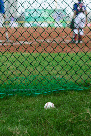 baseball outside of a baseball field with batter and catcher at background selective focusの写真素材