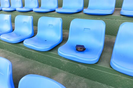 lost wallet on a stadium seatの写真素材