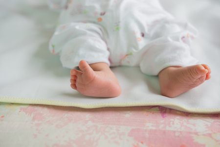 top view  of newborn baby feet on a carpetの写真素材