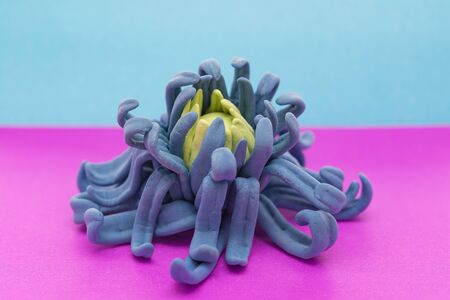 hand made flower on a purple and blue backgroundの写真素材