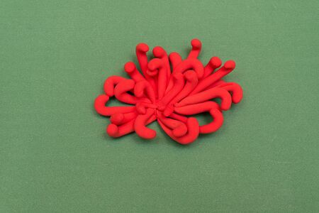 hand made red flower on a green backgroundの写真素材