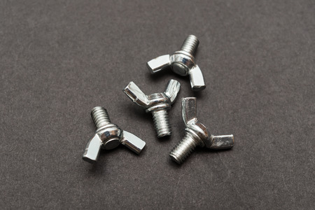 butterfly bolts on a black background