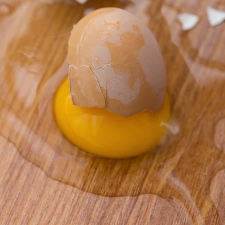 broken egg on floorの写真素材