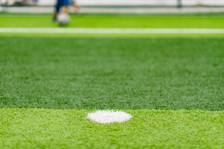 soccer field with kids playing in the far end selective focus