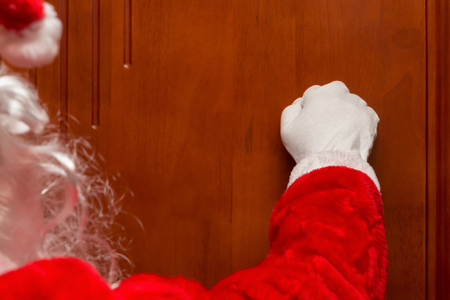 Santa Claus knocking the doorの写真素材