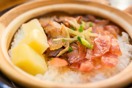 clay pot rice with bacon and sausage and potatoの写真素材