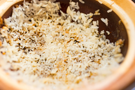 clay pot rice with the last bit on bottomの写真素材