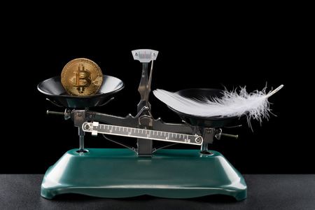 bitcoin lighter than a feather on black concept of bitcoin worthless