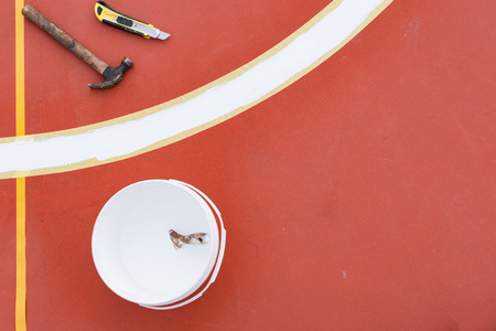 sideline for an outdoor stadium being prepared with tools