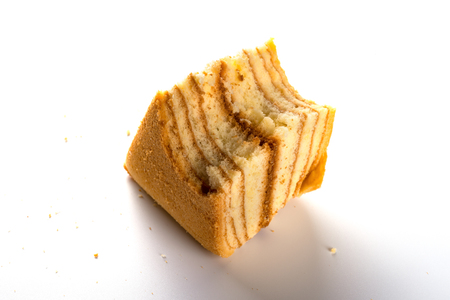 homemade sandwich shape sponge cage with a bites on whiteの写真素材