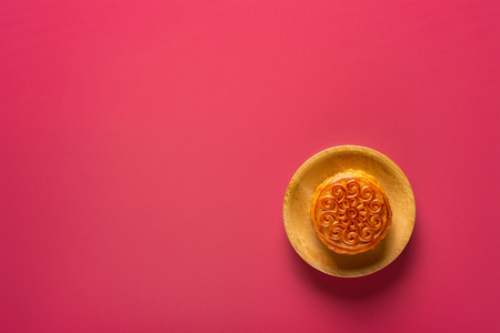 top view traditional style Chinese mooncake on red with copy spaceの写真素材