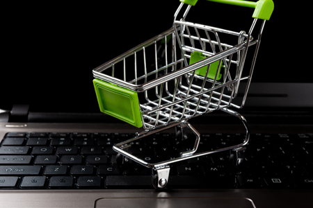shopping cart on a laptopの写真素材
