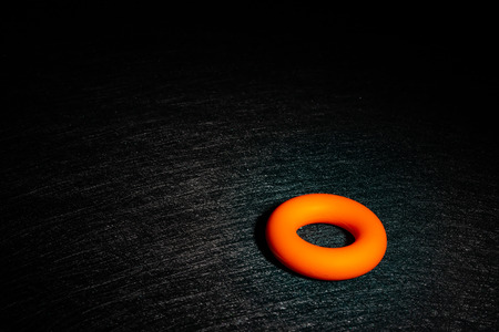 O ring hand trainer on a dark backgroundの写真素材