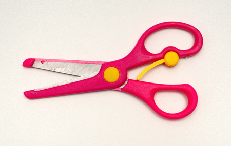 red handcraft scissors for children on a white backgroundの写真素材