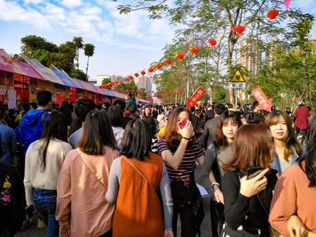 Foshan,Guangdong,China-Jan 27, 2019:People walking on the street selling things for the Chinese New Year.のeditorial素材