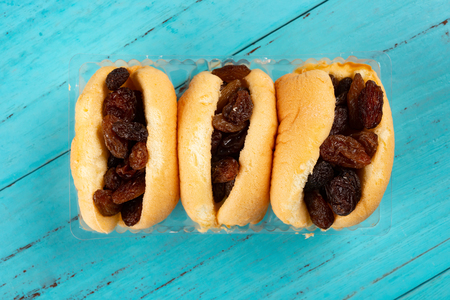 top view cakes with raisin on blue tableの写真素材